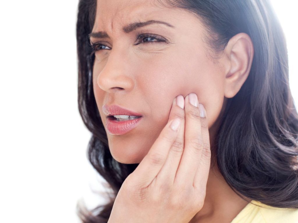 A women experiencing TMJ symptoms